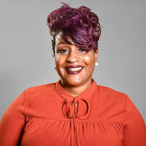addiction recovery non profit divas who win athens ga our story chanda Portrait of a Black Lady Smiling at the Camera wearing a red jumper with a grey backdrop. Chanda
