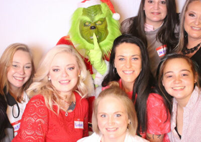 Christmas Themed Group Photo with Grinch being featured