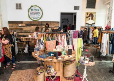 Inside Photo of Freedom Boutique with People Shopping from the Clothing Hangers