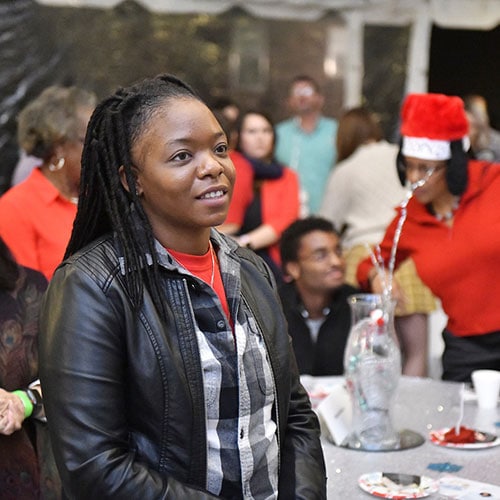 Portrait of African-American Lady Smiling and looking hopeful